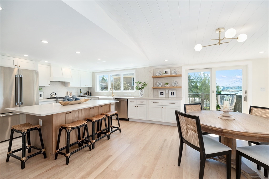 10 Fremont Street Gloucester, MA 01930 - Photo 4 of 37 a large kitchen with a table and chairs