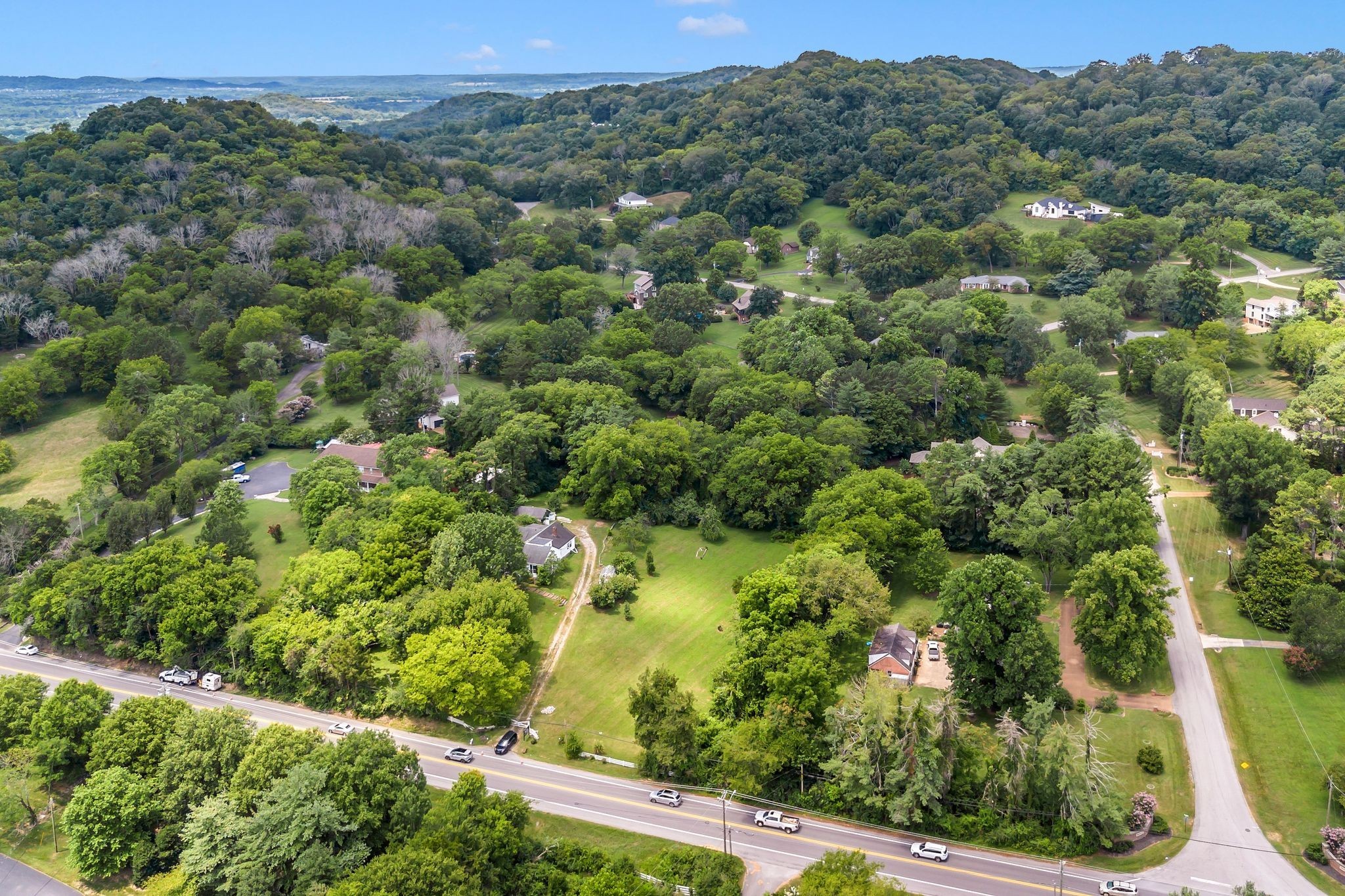 517 Franklin Road Franklin, TN 37069 - Photo 1 of 22 an aerial view of a residential houses covered with trees