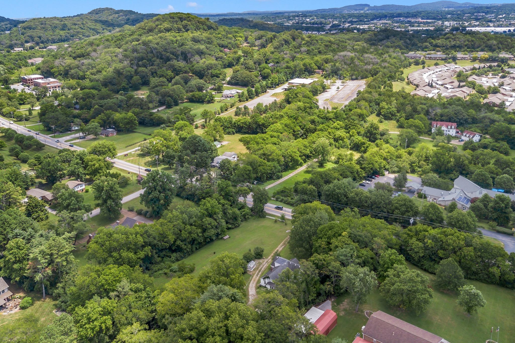 517 Franklin Road Franklin, TN 37069 - Photo 10 of 22 a view of a house with a lush green forest