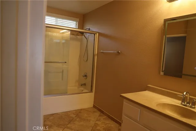 a bathroom with a sink and shower