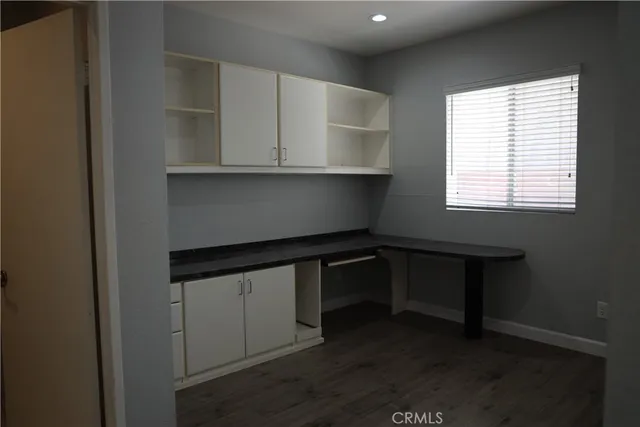 a room with cabinet and window