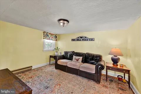 a living room with furniture and a rug