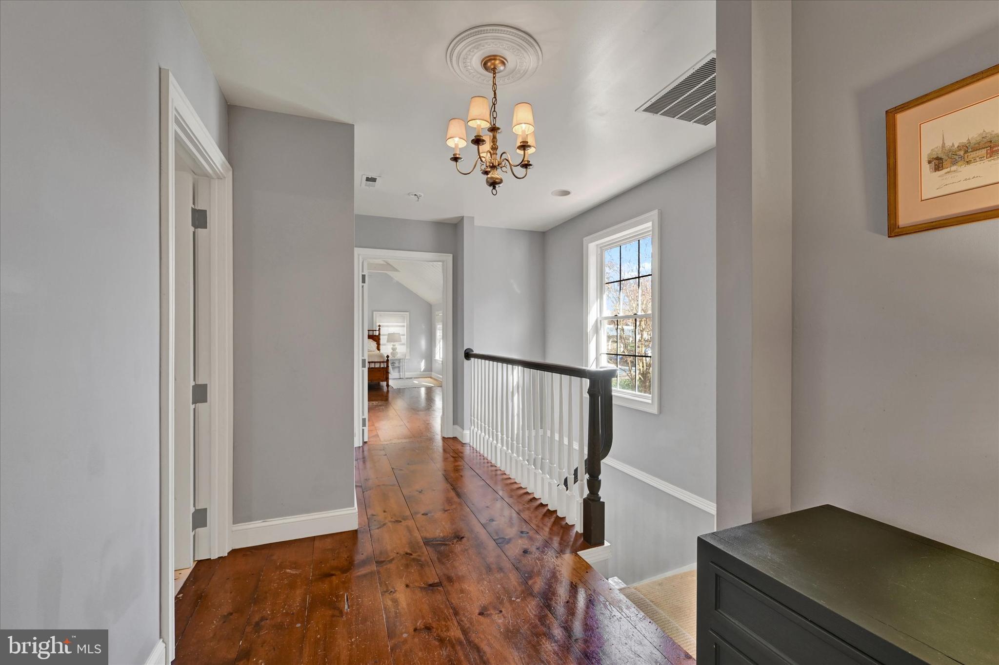 16535 Trenton Road Upperco, MD 21155 - Photo 20 of 41 a view of a hallway with wooden floor and staircase