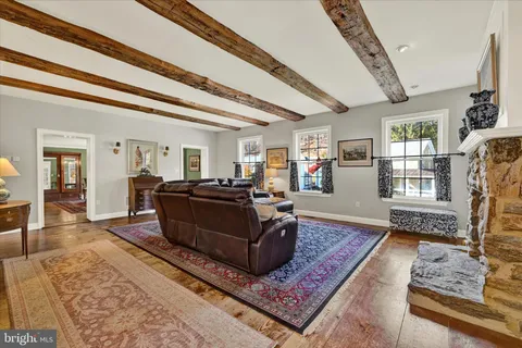a living room with furniture and a rug