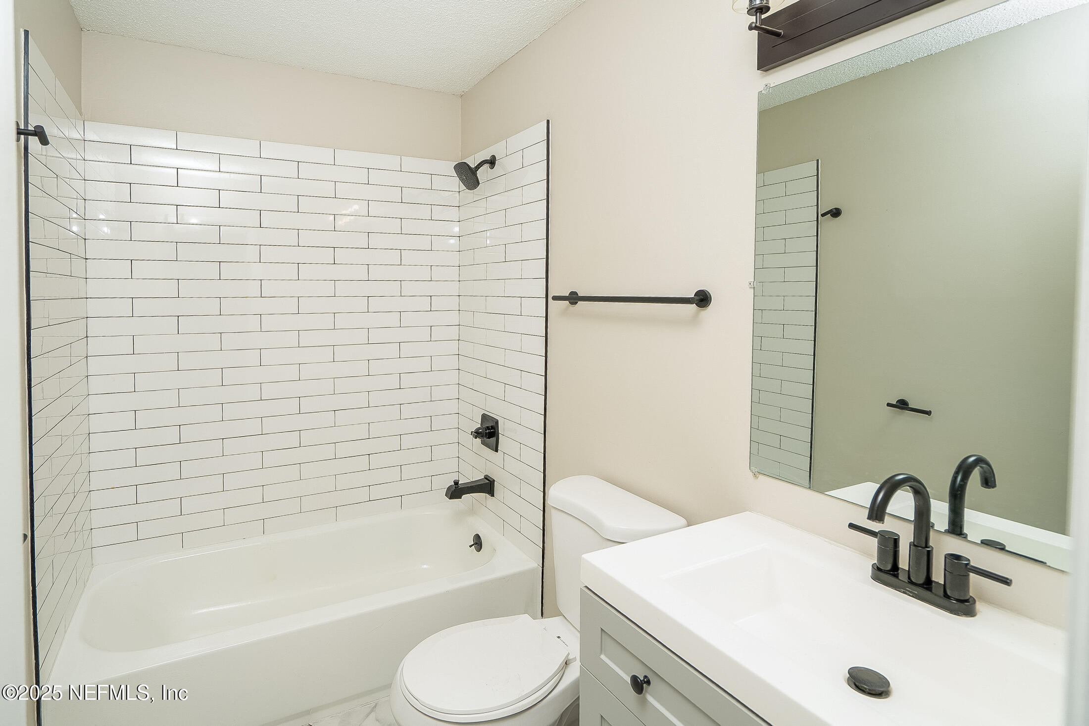 1131 Butler Avenue St. Augustine, FL 32084 - Photo 11 of 15 a bathroom with a sink toilet and shower
