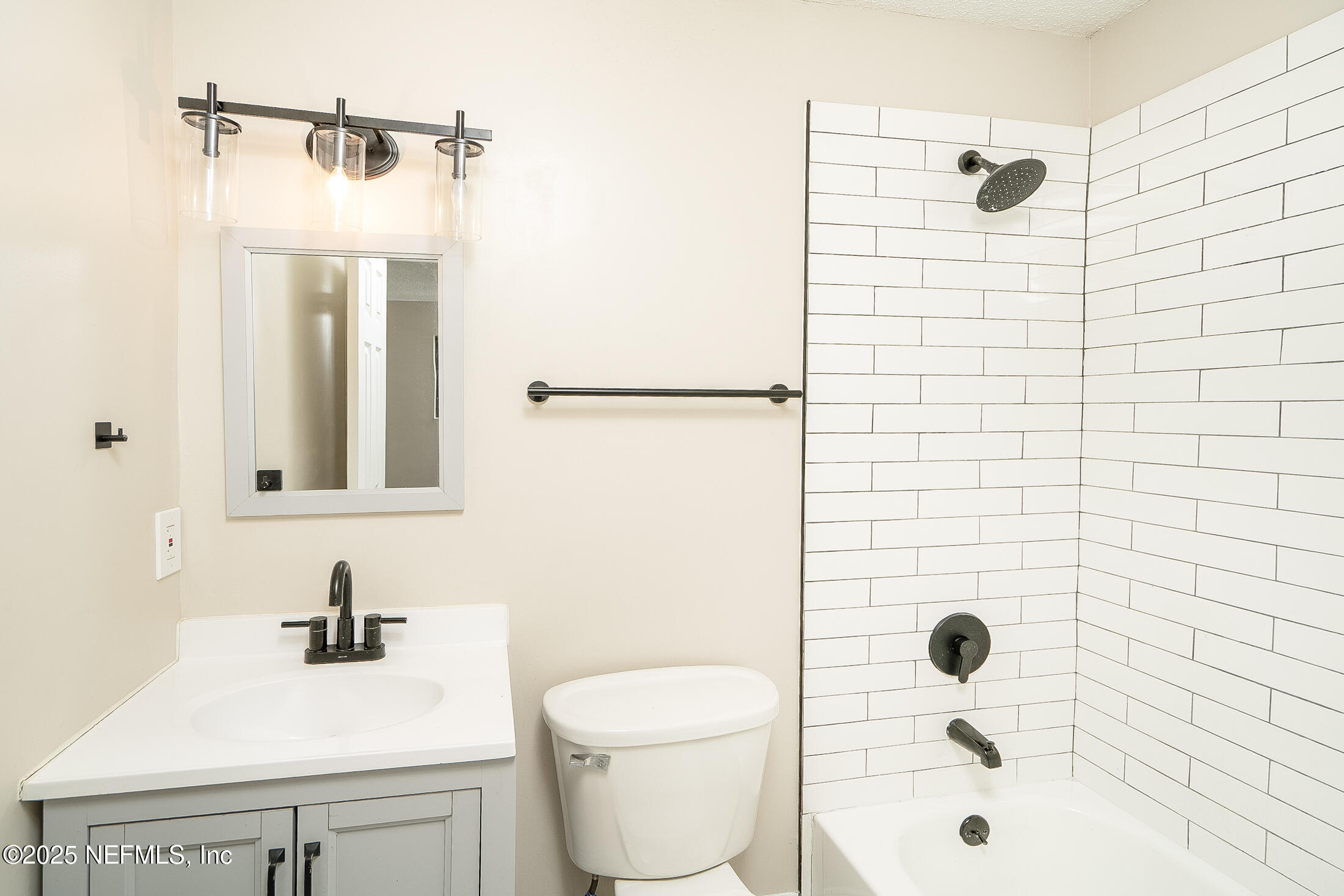 1131 Butler Avenue St. Augustine, FL 32084 - Photo 14 of 15 a bathroom with a sink a toilet and shower