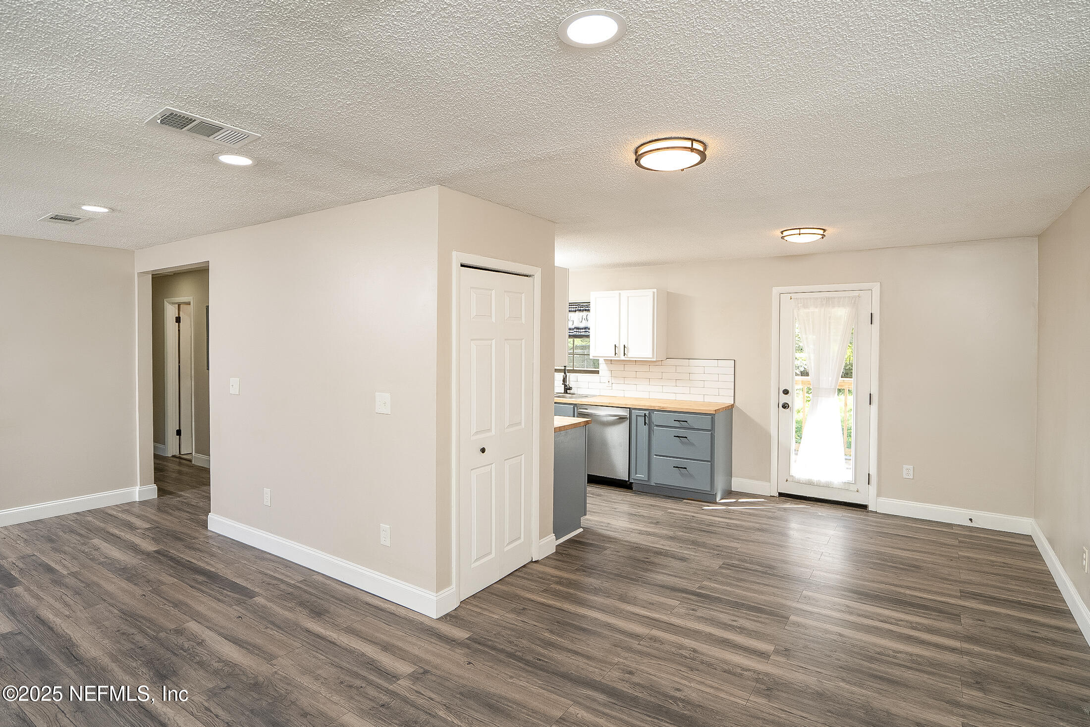 1131 Butler Avenue St. Augustine, FL 32084 - Photo 4 of 15 a view of a kitchen with a sink and a refrigerator
