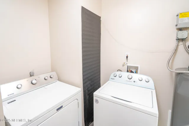 a utility room with dryer and washer