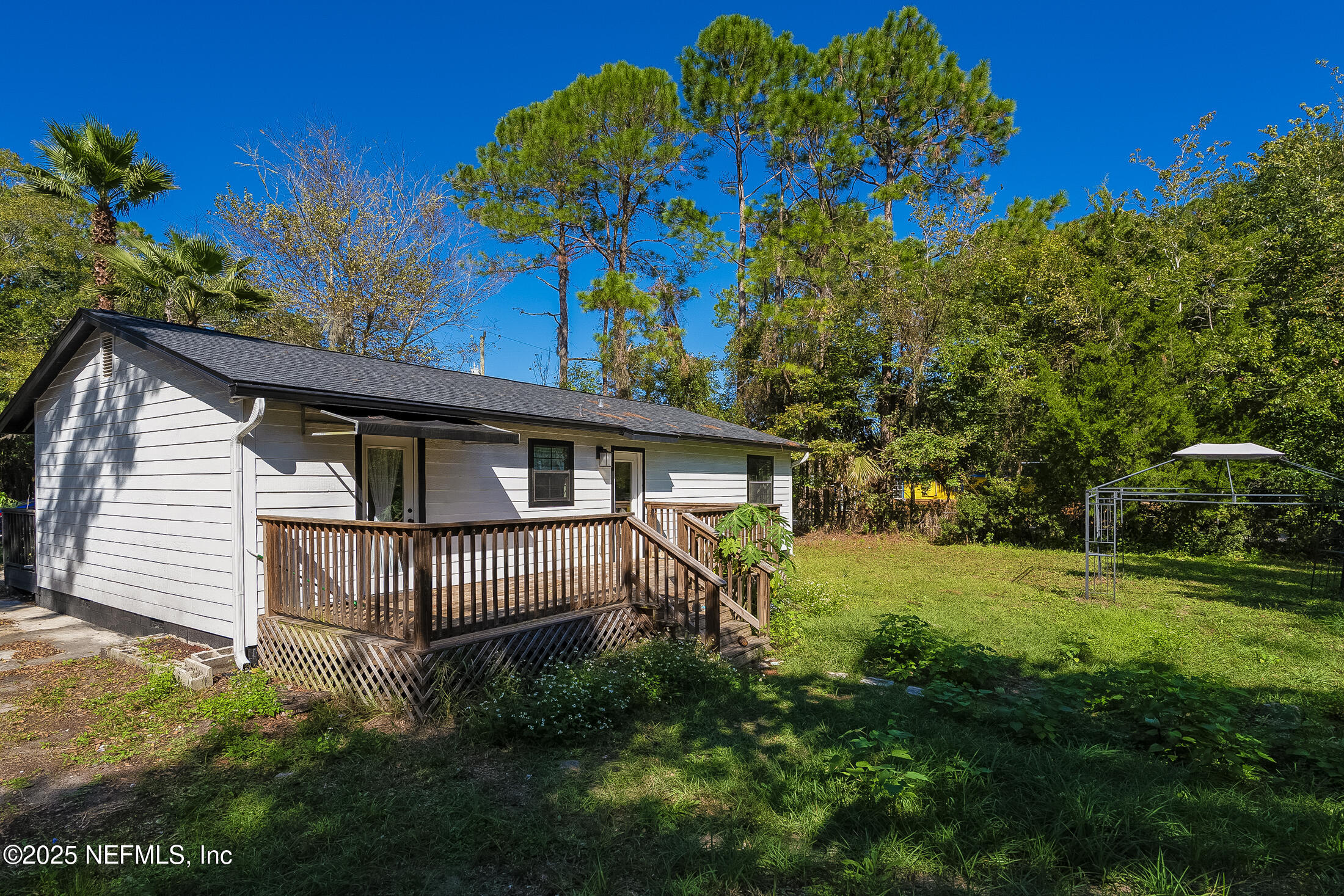 1131 Butler Avenue St. Augustine, FL 32084 - Photo 10 of 15 a view of a house with a yard