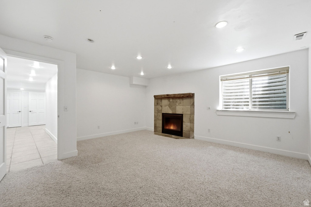 3027 Homestead Road Park City, UT 84098 - Photo 47 of 62 Spacious room featuring light-toned carpeting and a corner fireplace with stone surround and wood mantel