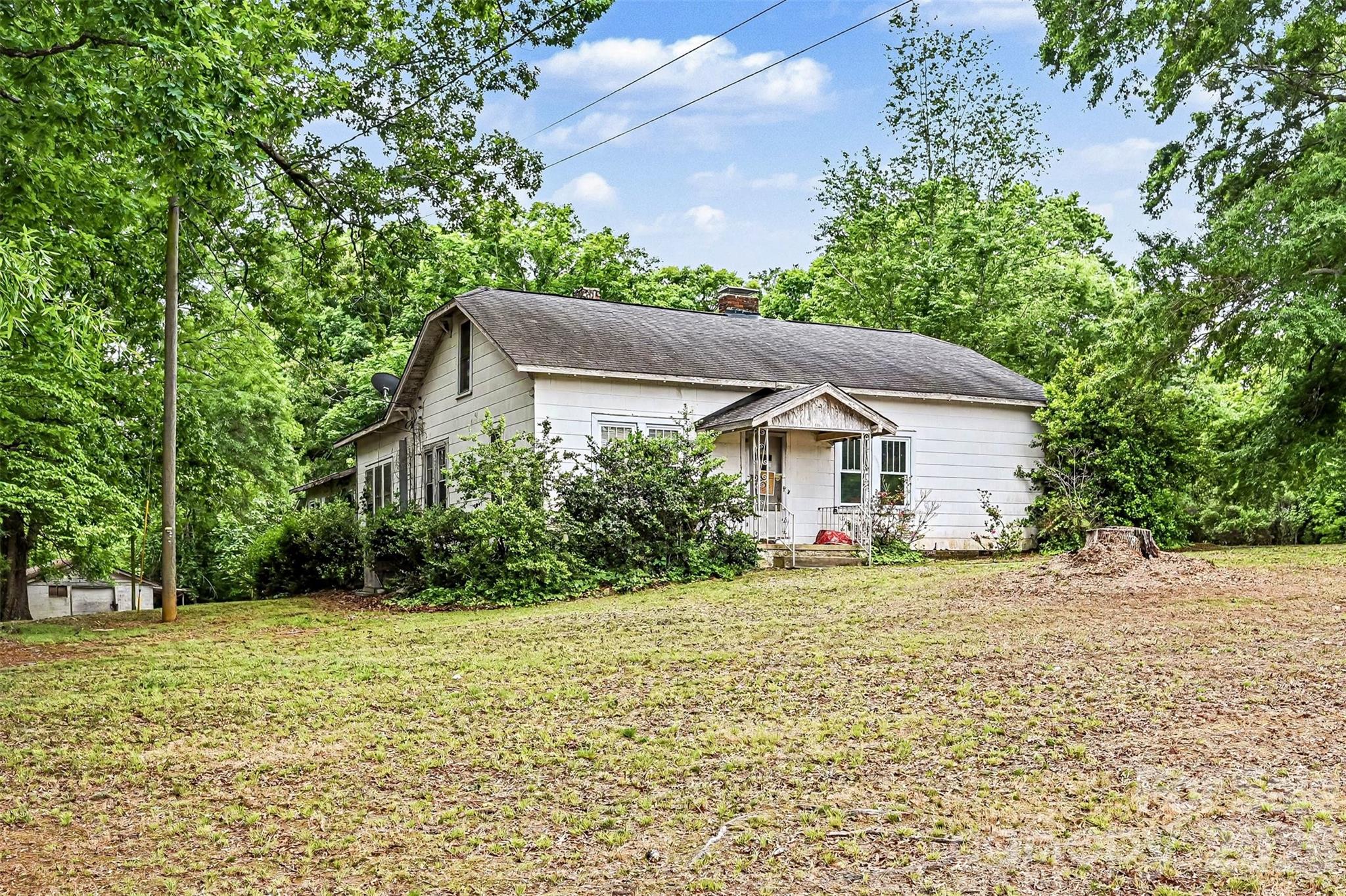 a house with trees in the background