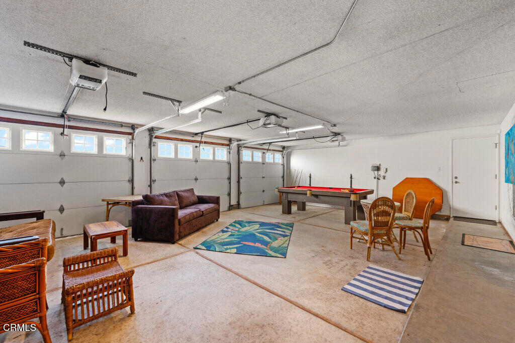 5003 Island View Street Oxnard, CA 93035 - Photo 14 of 30 a living room with furniture a table and chairs