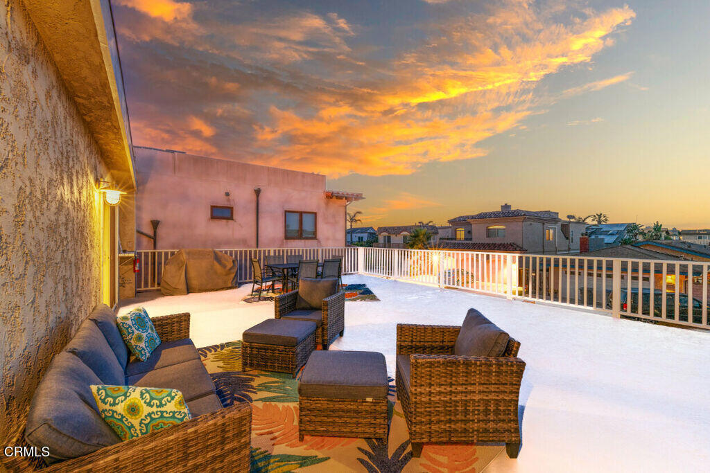 5003 Island View Street Oxnard, CA 93035 - Photo 2 of 30 a balcony with furniture and city view