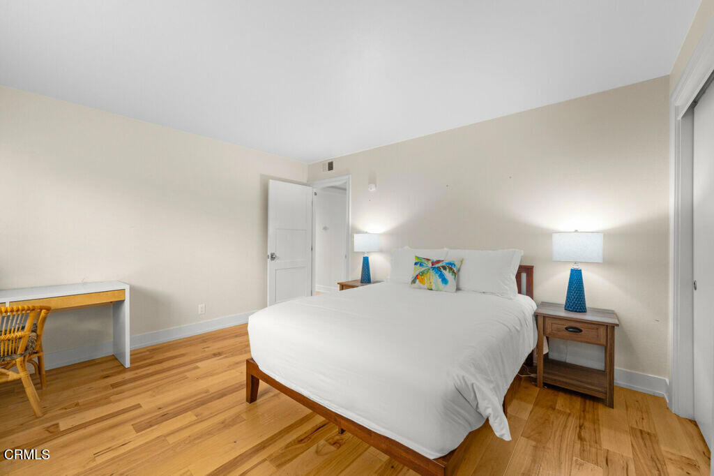 5003 Island View Street Oxnard, CA 93035 - Photo 21 of 30 a bedroom with a bed and wooden floor