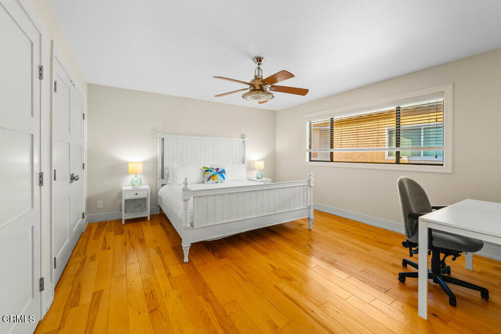 5003 Island View Street Oxnard, CA 93035 - Photo 24 of 30 a bedroom with a bed and wooden floor