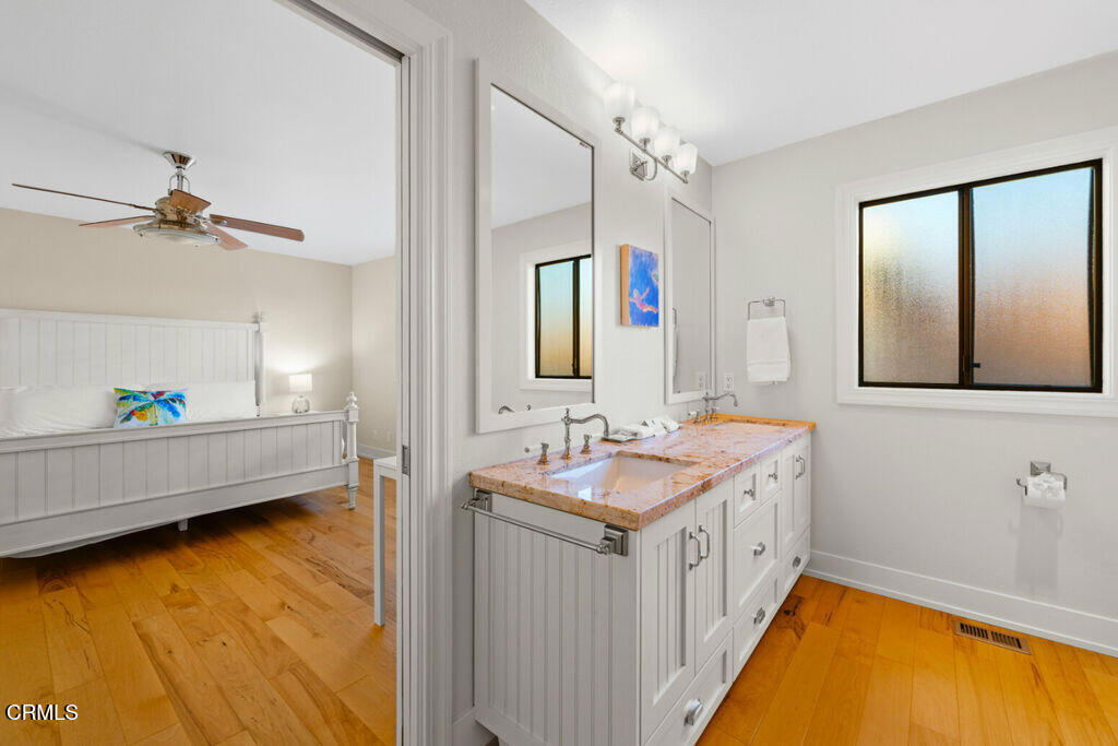 5003 Island View Street Oxnard, CA 93035 - Photo 25 of 30 a bathroom with a tub a sink and mirror