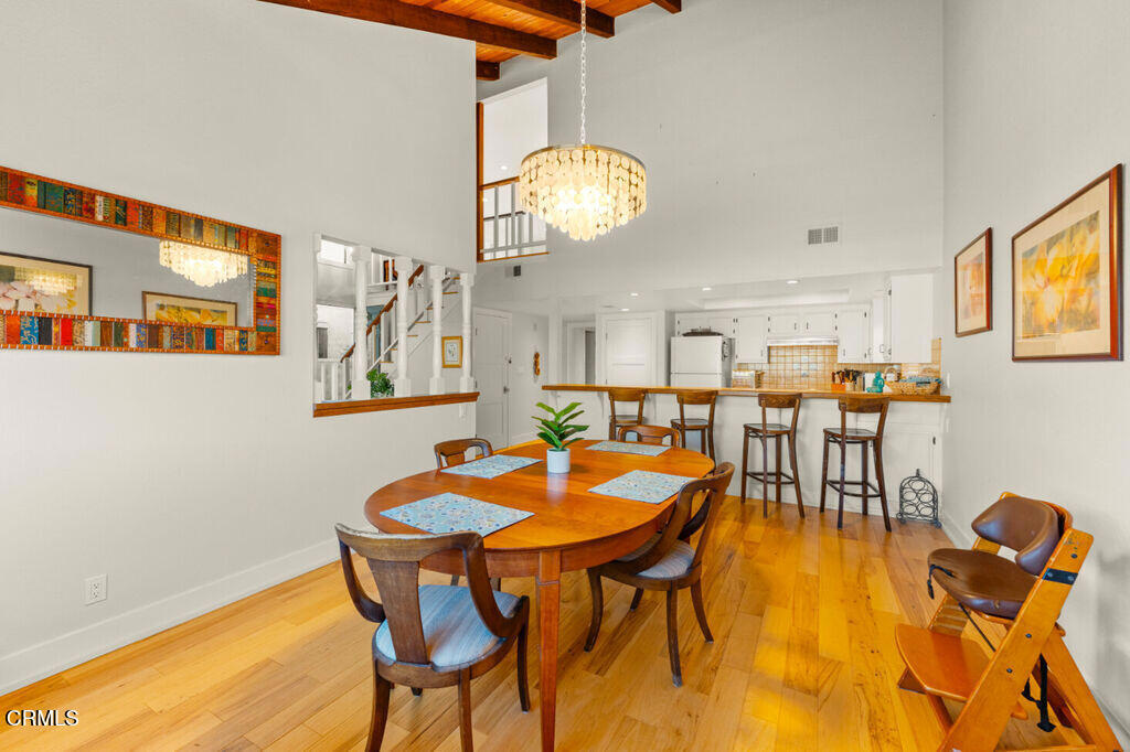 5003 Island View Street Oxnard, CA 93035 - Photo 10 of 30 a view of a dining room with furniture and chandelier