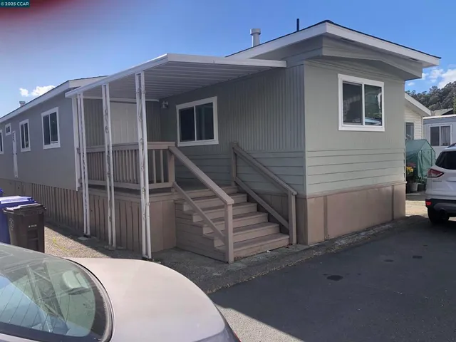a view of a house with wooden floor and a sink