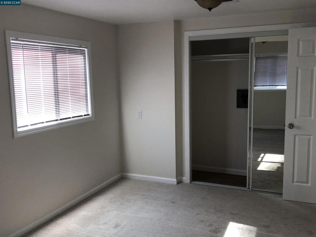 4556 Appian Way El Sobrante, CA 94803 - Photo 11 of 16 an empty room with a window