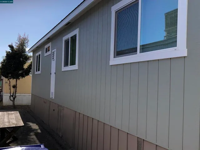 a view of a house with a small yard