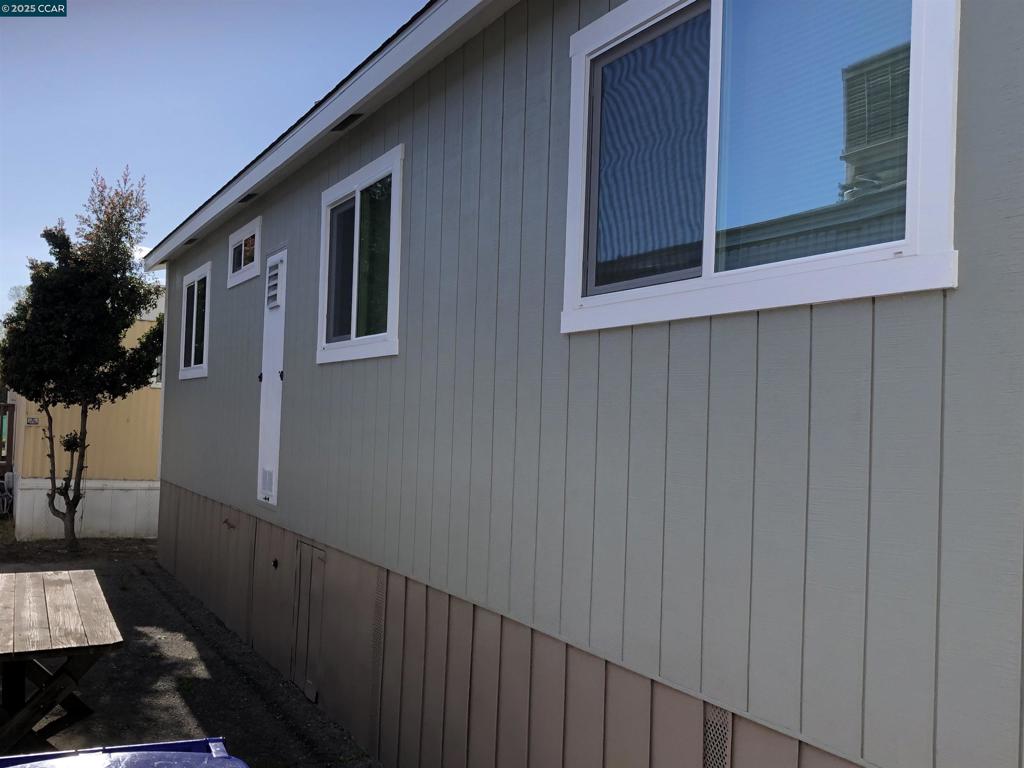 4556 Appian Way El Sobrante, CA 94803 - Photo 3 of 16 a view of a house with a small yard