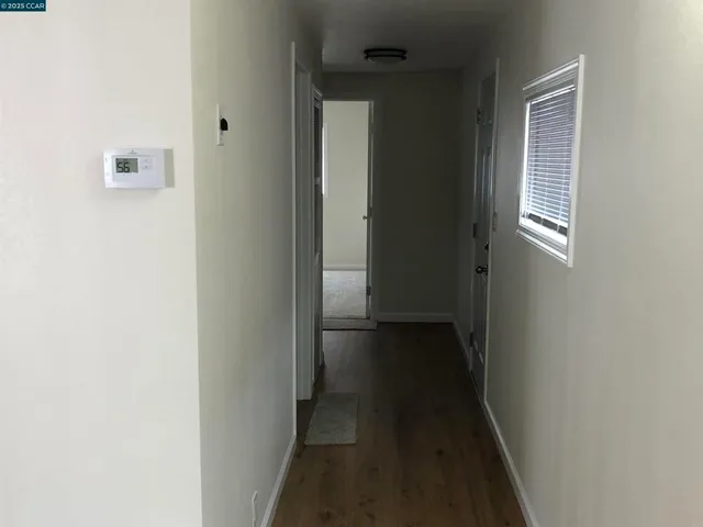 a kitchen with a refrigerator and a sink