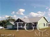 22470 North River Road Alva, FL 33920 - Photo 2 of 7 a house view with a garden space