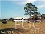 22470 North River Road Alva, FL 33920 - Photo 3 of 7 a view of a swimming pool with a yard