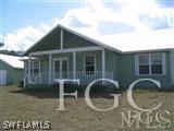 22470 North River Road Alva, FL 33920 - Photo 6 of 7 a front view of a house