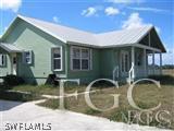 22470 North River Road Alva, FL 33920 - Photo 7 of 7 a view of a house with backyard