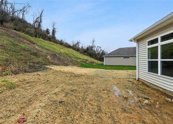 a view of a backyard of the house