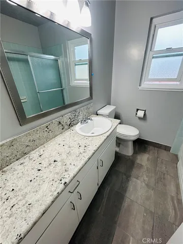 a bathroom with a sink and a toilet
