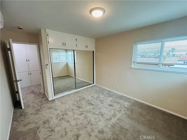 an empty room with a mirror