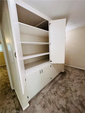 a view of an empty walk in closet