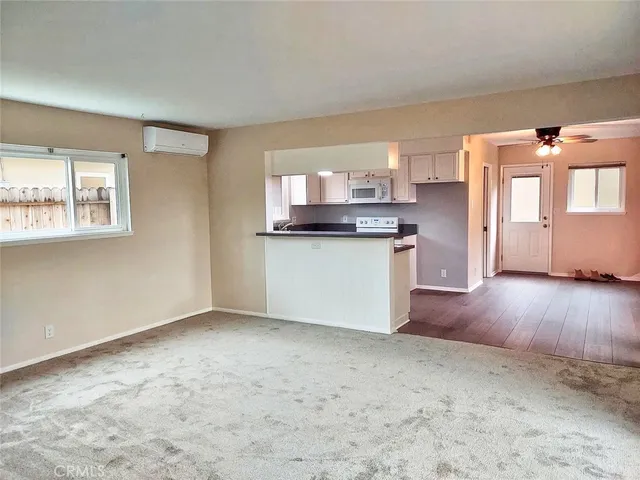 a kitchen with a stove a sink and a refrigerator