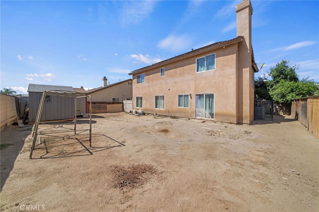 4475 Willowglen Way Hemet, CA 92545 - Photo 32 of 33 a view of a house with a backyard