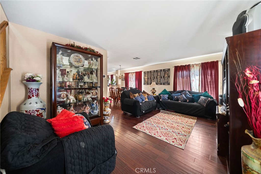 4475 Willowglen Way Hemet, CA 92545 - Photo 8 of 33 a living room with furniture and a flat screen tv