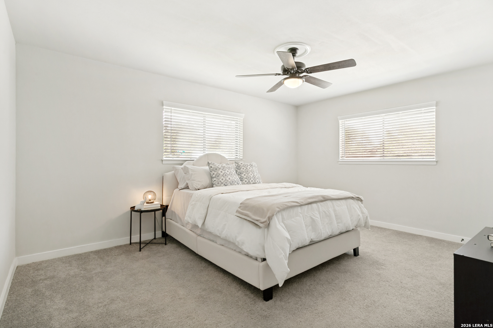 102 Silver Spring Universal City, TX 78148 - Photo 24 of 36 a bedroom with a bed and window