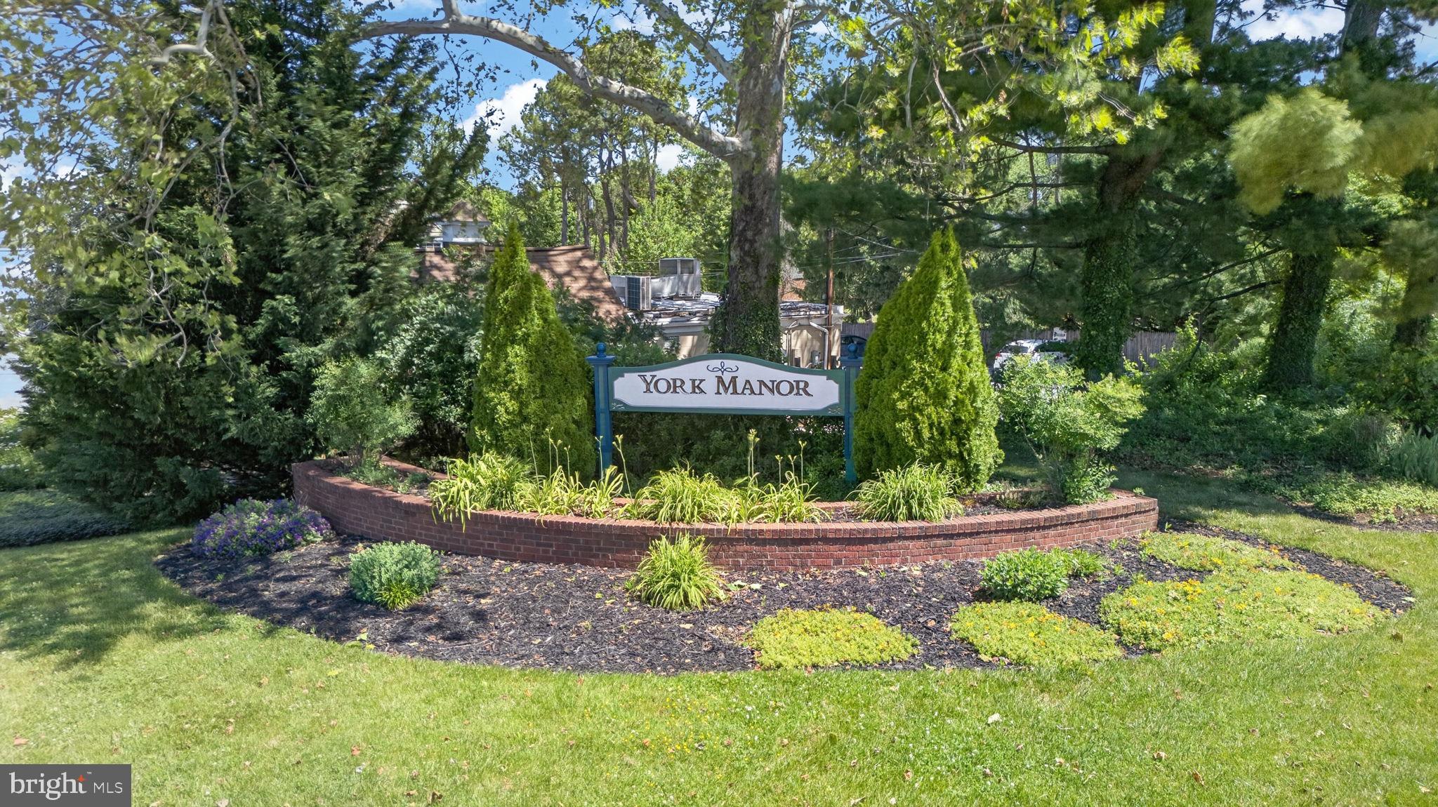 9 Haddington Road Lutherville-Timonium, MD 21093 - Photo 2 of 55 a view of a garden with a bench