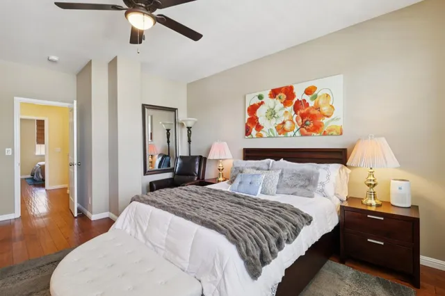 a bedroom with a bed and a chandelier