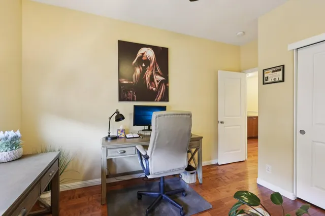 a workspace with furniture and wooden floor