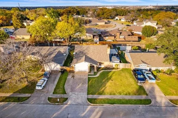 an aerial view of residential houses with outdoor space