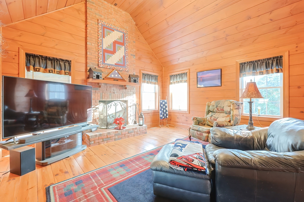 11 Brigham Road Paxton, MA 01612 - Photo 16 of 42 a living room with furniture and a flat screen tv