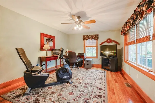 a living room with furniture a rug and a chandelier
