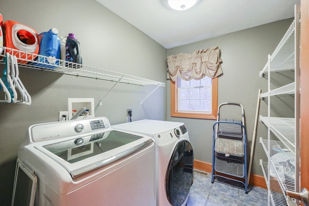 11 Brigham Road Paxton, MA 01612 - Photo 20 of 42 a utility room with dryer washer and a view of kitchen