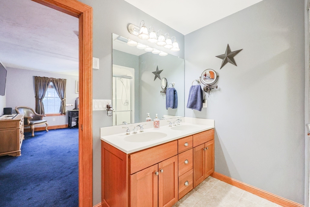 11 Brigham Road Paxton, MA 01612 - Photo 25 of 42 a bathroom with a sink a vanity and a mirror