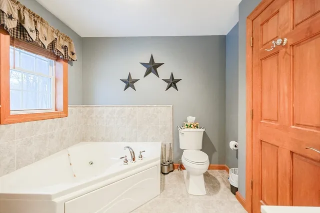 a bathroom with a bathtub sink and toilet