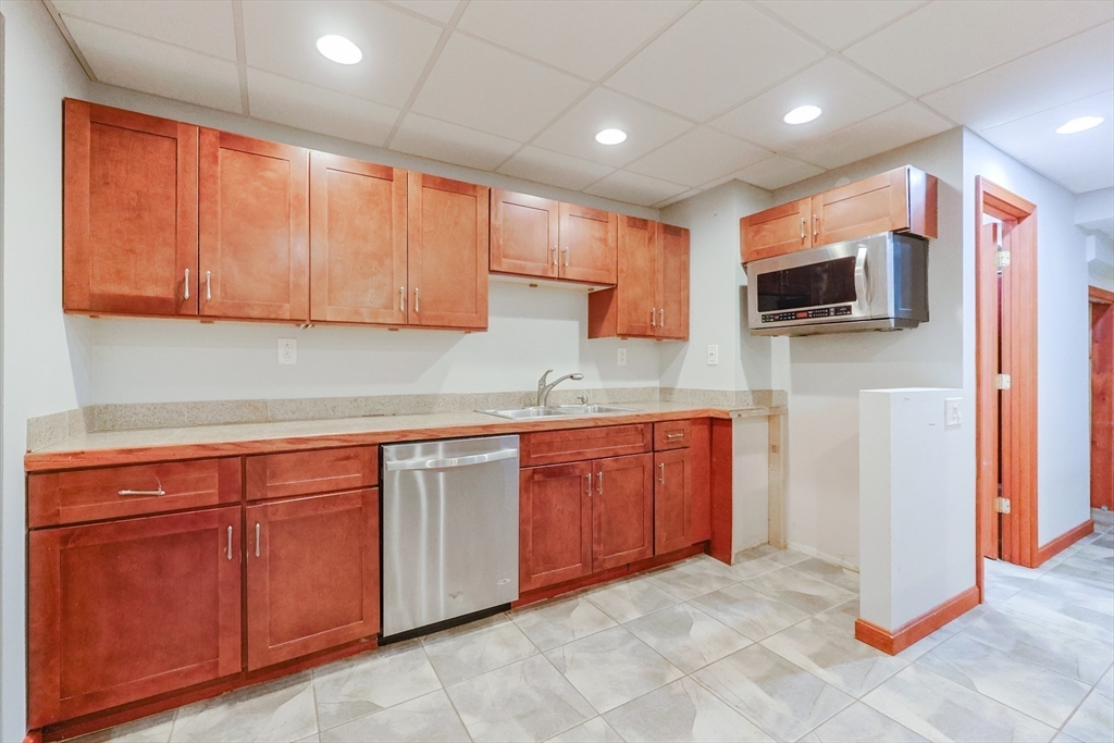 11 Brigham Road Paxton, MA 01612 - Photo 32 of 42 a kitchen with stainless steel appliances granite countertop a stove a sink and a microwave