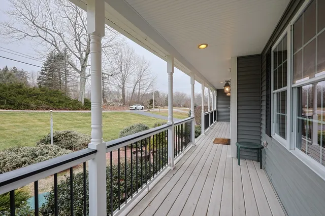 a view of a balcony with wooden floor