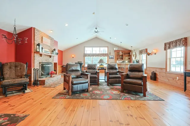a living room with furniture or couch and a large window